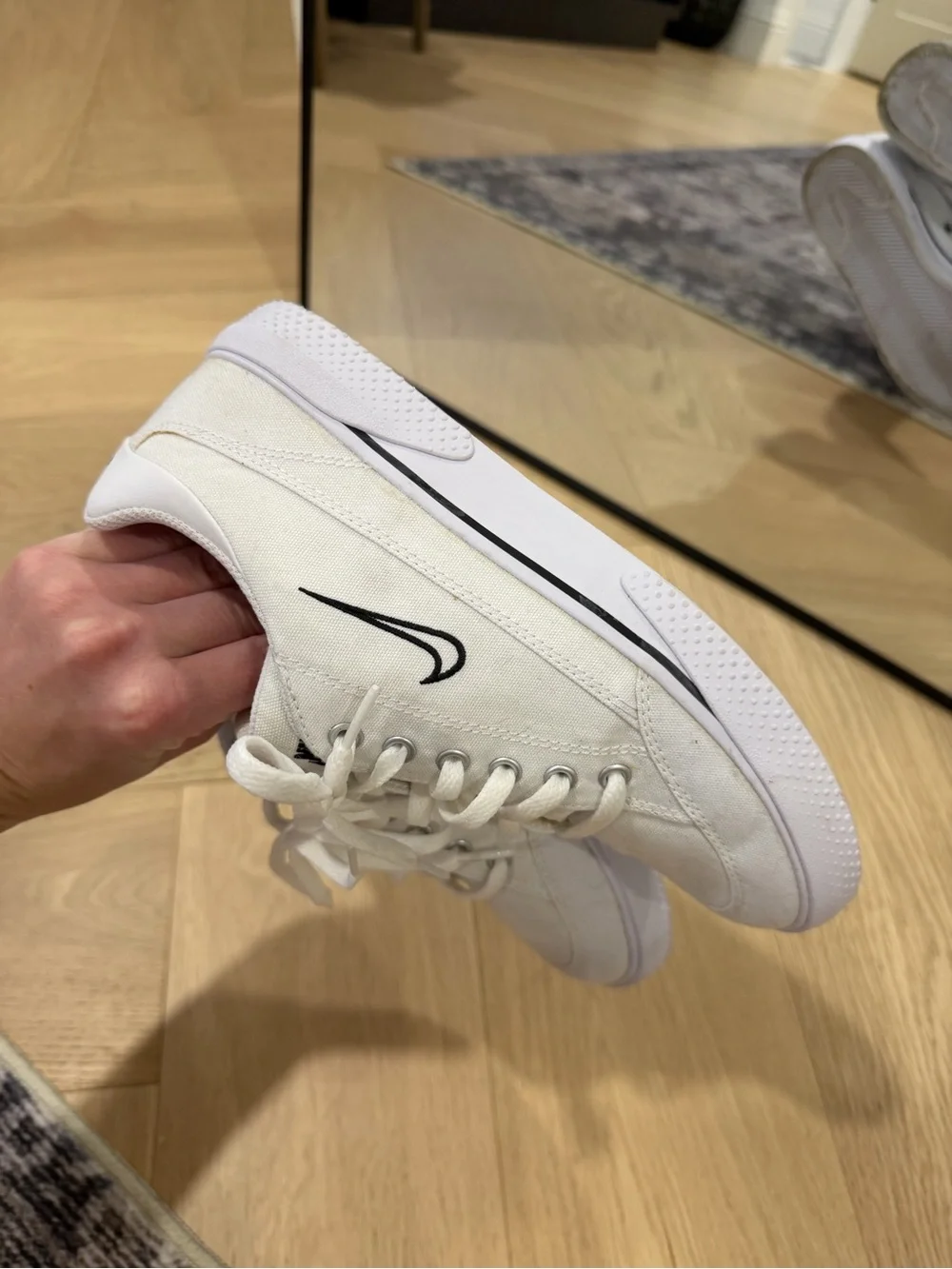 Nike Women’s White Canvas Sneakers with Black Swoosh
